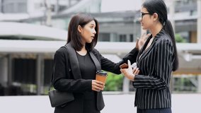 Young generation business team not working together concept. Young business intern Asian woman having very serious fight and arguments with her Asian female manager, dramatic expression. Medium shot. - Powered by Shutterstock - Get 15% off with code: PIKWIZARD15