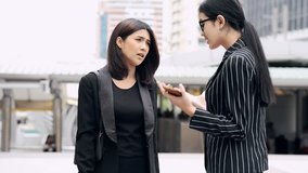 Young generation business team not working together concept. Young business intern Asian woman having very serious fight and arguments with her Asian female manager, dramatic expression. Medium shot. - Powered by Shutterstock - Get 15% off with code: PIKWIZARD15