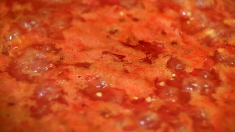 Cooking delicious tomato sauce closeup