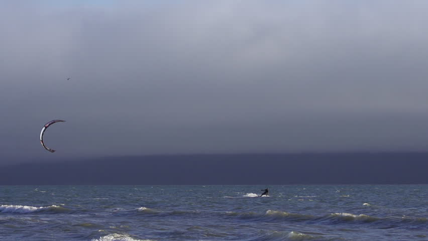 Slow Motion Kite Surfer Waves and Foggy Clouds