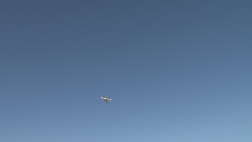 Off-the-cuff handheld/tripod stabilized shot of a small airplane passing by