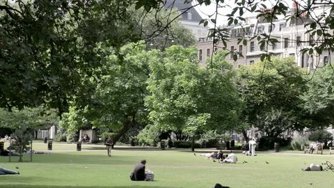 London. July 2017. People relaxing in Lincoln's Inn Fields on a sunny Sunday afternoon in summer.