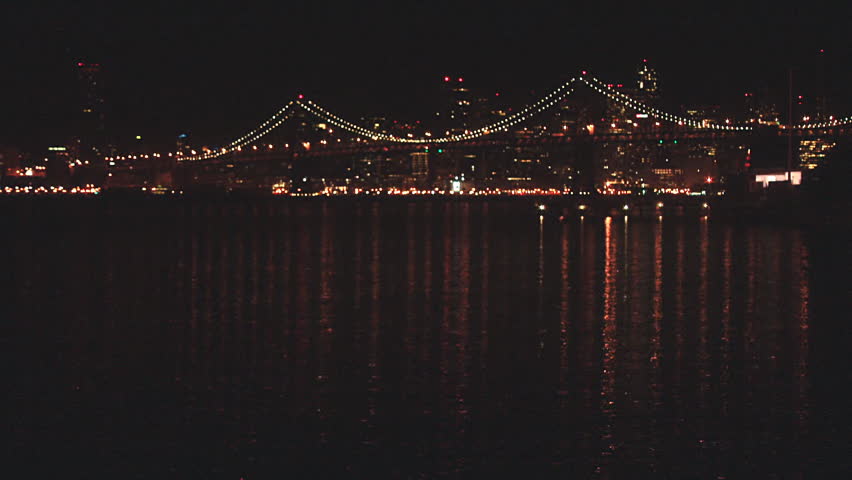 San Francisco as seen at night through the Bay Bridge, static shot taken from