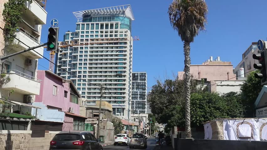 TEL AVIV, ISRAEL - SEPTEMBER 29, 2017: Hayarkon street before Sukkot holiday. It is a major street which carrying traffic north and south. On the right, Sukkah is visible. On Sep 29, 2017 in Tel Aviv.