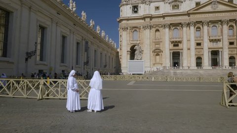 VATICAN CITY - 9 JULY 2017: Sisters in Christ on the square in front of St. Peter's Basilica in the Vatican.