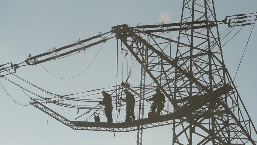 Workers at a transmission line