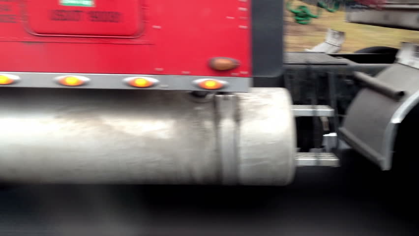 Passing a semi truck on an interstate highway.