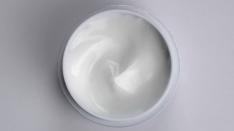 Closeup shot of cosmetics cream with rotate, Top view
