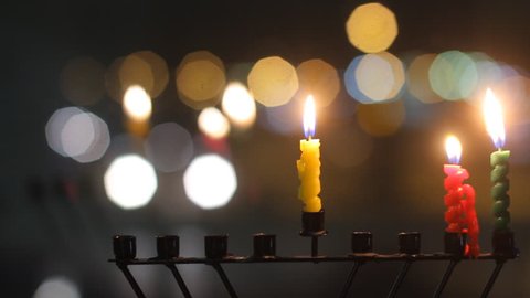 Beautiful candles and Hanukkah menorah with defocused background, dolly shot.  ஸ்டாக் வீடியோ
