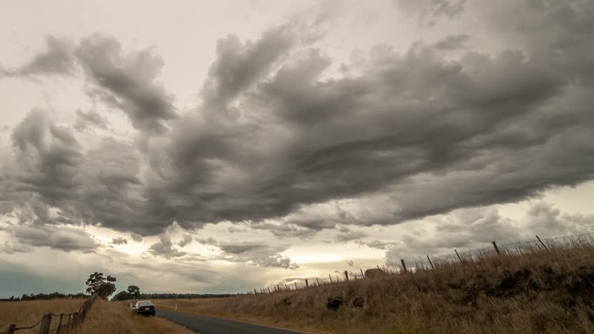 Time-lapse of Storm clouds loom over pastureland on Geelong countryside