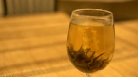 Close up motion slider shot of a special hot flower tea, brewed at home