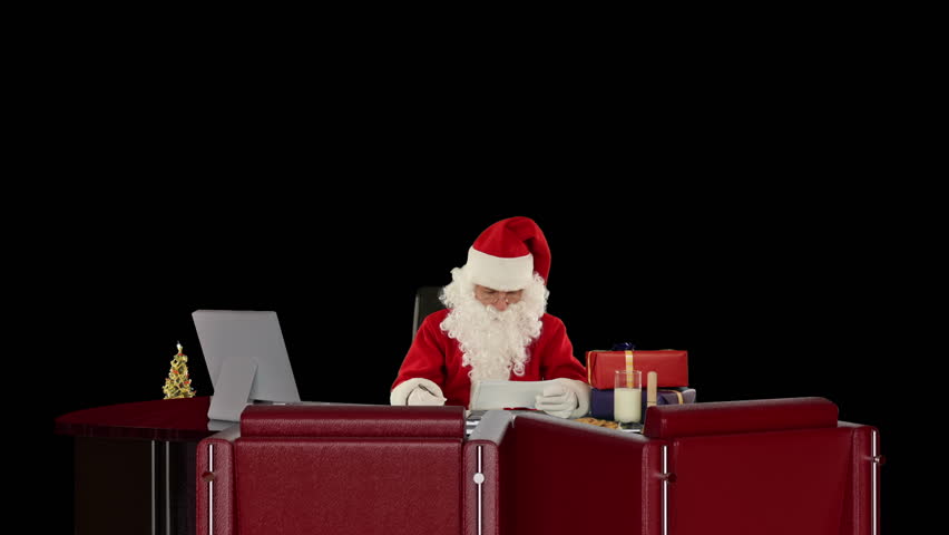 Santa Claus reading letters and sorting presents, against black