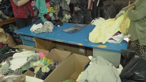 humanitarian aid. old clothes. Clothes pile for poor people. secondhand.