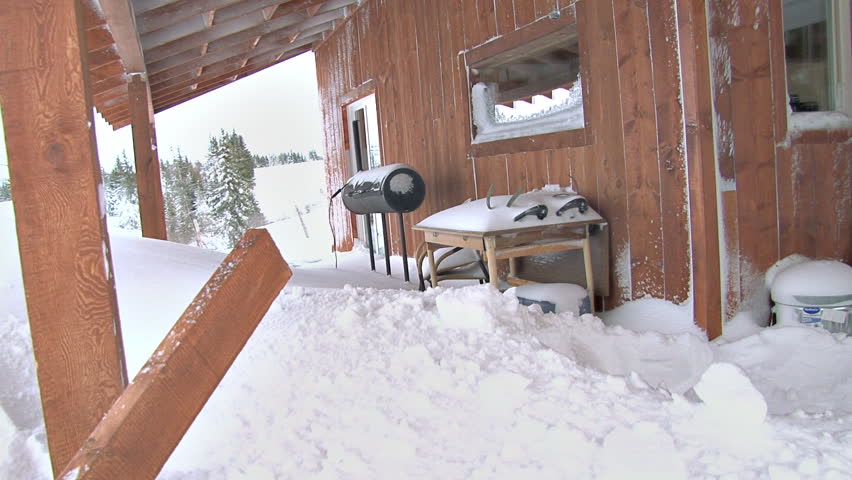 Man shovels porch after big snowstorm 