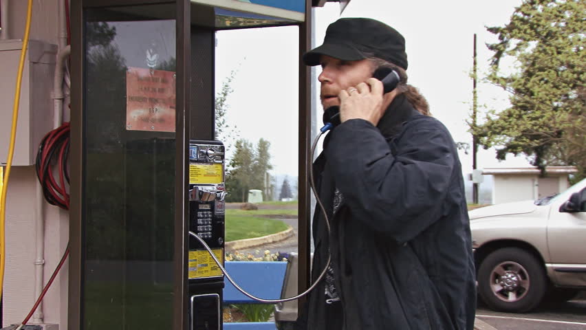 Man Using pay phone