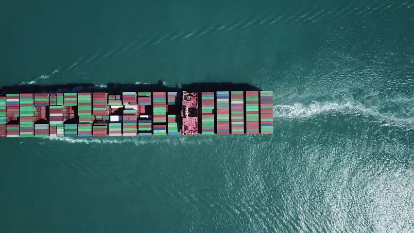 Mega huge ULCV container ship is sailing full loaded with containers and cargo - aerial 4k view | Shutterstock HD Video #31293523