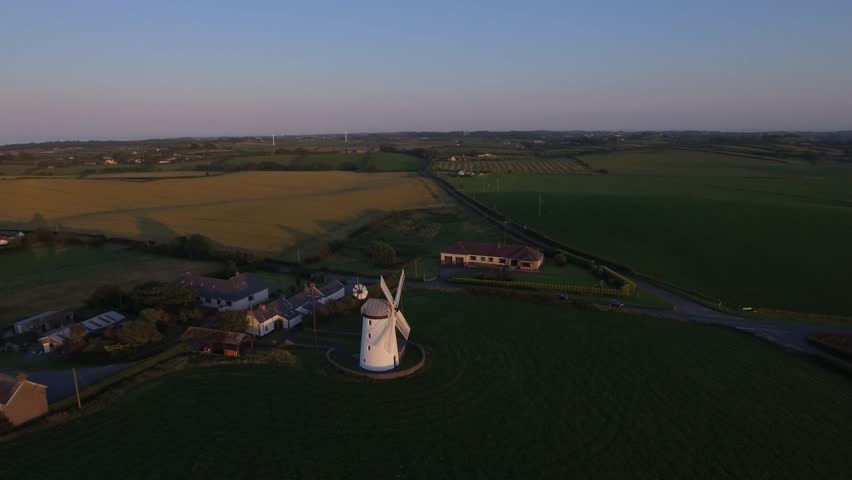 old windmill at sunset