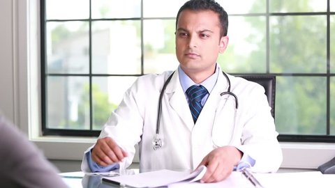 Closeup portrait, patient having conversation and signing documents with healthcare professional, isolated indoors clinic background