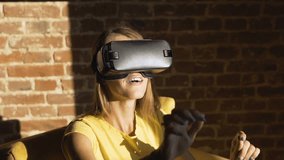 Fair hair caucasian girl experiencing a virtual reality helm joyfully, slow motion