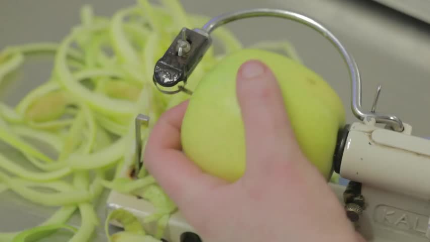 Peeling a green apple
