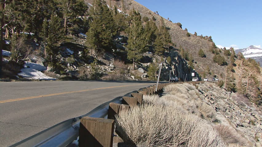 SIERRA NEVADA, CA - CIRCA 2012: Passenger cars and trucks file up and down the