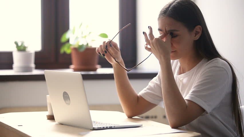 Tired of glasses woman feeling eyestrain using laptop at home office, taking off spectacles, massaging dry red irritated eyes, exhausted lady having eyesight problem after long work study on computer Royalty-Free Stock Footage #31313926