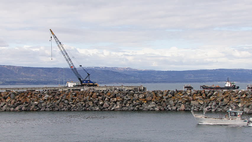 HOMER, AK - CIRCA 2012: Out in the bay, a large landing craft with a load of