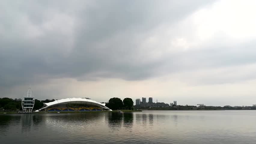Time lapse during the day at lake with some water activity is on going