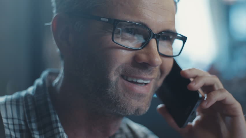 The man in his glasses speaks on the phone fluttering the book interior design. Something is looking for. Design Business. Enthusiastic. Design, abstract. Shot on RED Epic Camera. | Shutterstock HD Video #31330261