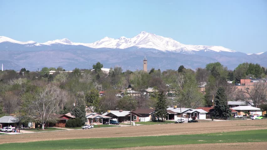 The beautiful Mount Evans, Westminster City Hall with house and farmland as foreground