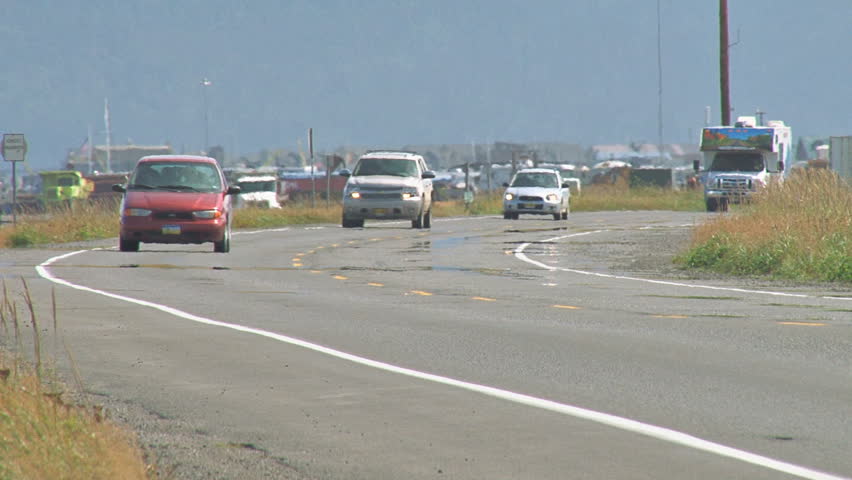 HOMER, AK - CIRCA 2011: Mid-season traffic on a bend of the Homer Spit Road.