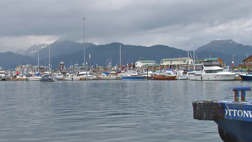 HOMER, AK - CIRCA 2012: Panning right to left from a wide shot of the small boat