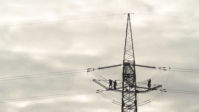 Men on a power line