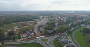 Aerial footage of foliage in small Estonian town. Autumn aerial flyover of scenic alley in town.