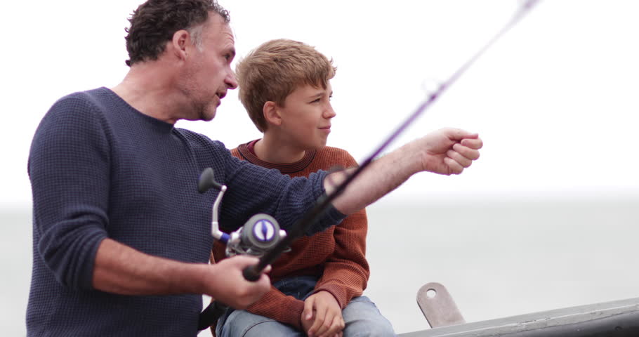 Father teaching Son how to fish