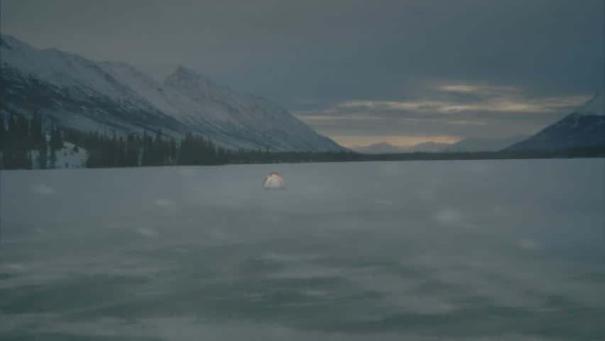 Tent in Barren Landscape with Heavy