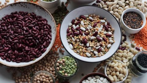 Various dry legumes on a wooden background. Top view