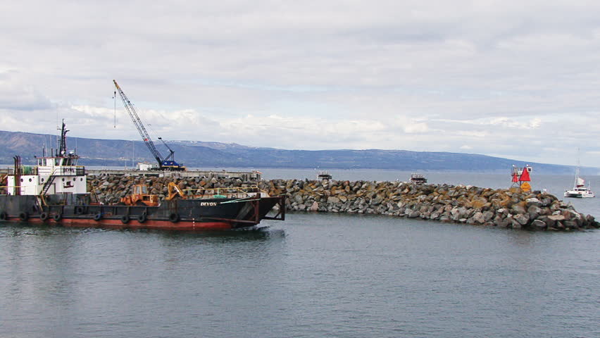 HOMER, AK - CIRCA 2012: Large industrial landing craft leaving Homer Harbor ,