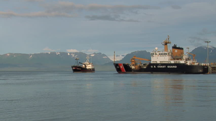 HOMER, AK - CIRCA 2012: Large crabbing vessel/fish tender about to pass Coast