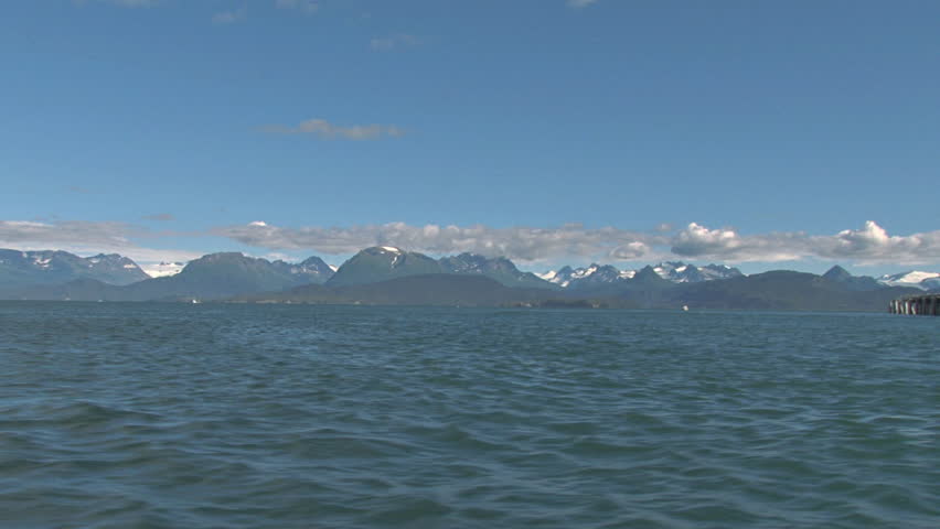 HOMER, AK - CIRCA 2012: Coast Guard at mooring from side view of small boat