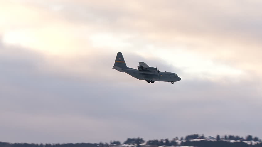 HOMER, AK - CIRCA 2012: HC130 making a low banking turn on approach to the
