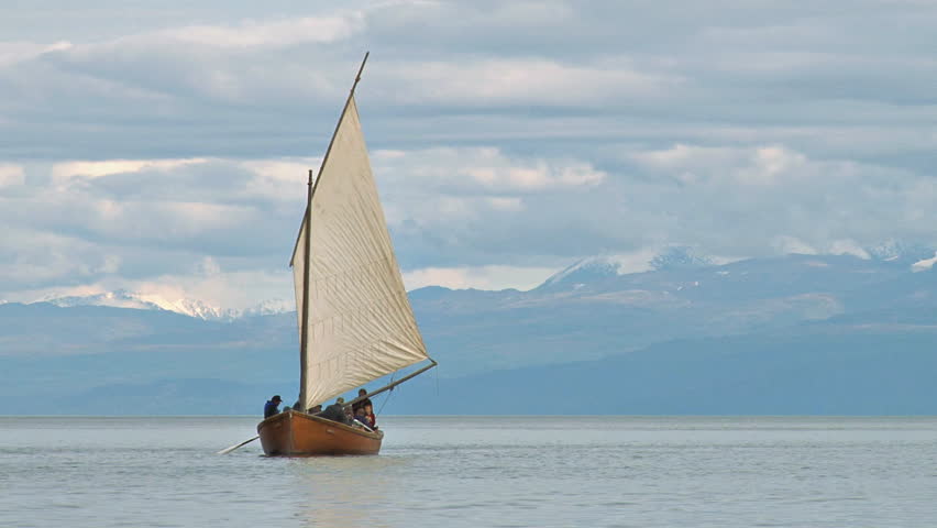 HOMER, AK - CIRCA 2011: Classic wooden sailboat plying the bay waters with a