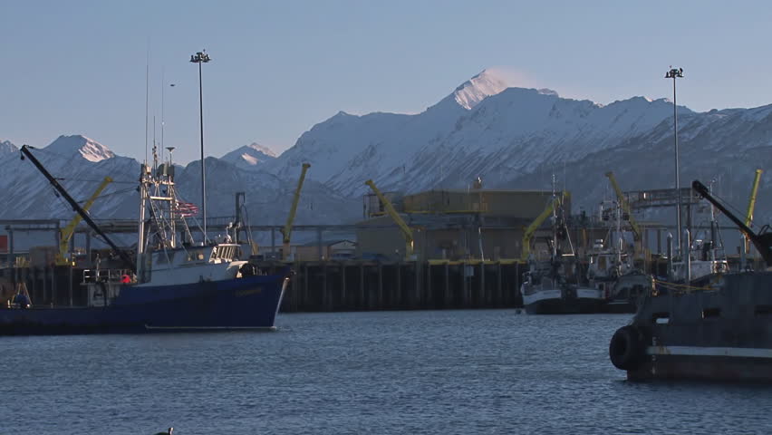 HOMER, AK - CIRCA 2012: Fishing trawler enters harbor.