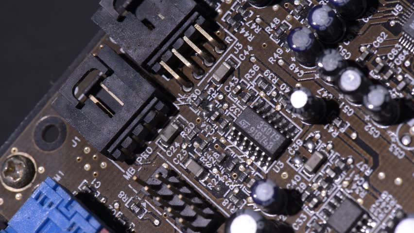 Computer circuits hardware footage. Motherboard parts, chips, connections, circuit boards visible. | Shutterstock HD Video #31359352