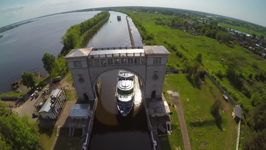 Arch lock from above Volga river lake cruise ship. Best Russian nature field forest tourism. Drone unique footage.  