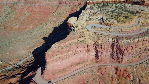 CIRCA 2010s - Shiprock, New Mexico - Aerial as a car travels on the dangerous mountain road of Moki Dugway, New Mexico, desert Southwest.