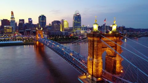 CIRCA 2010s - Cincinnati, Ohio - A beautiful evening aerial shot of Cincinnati Ohio with bridge crossing the Ohio River foreground.