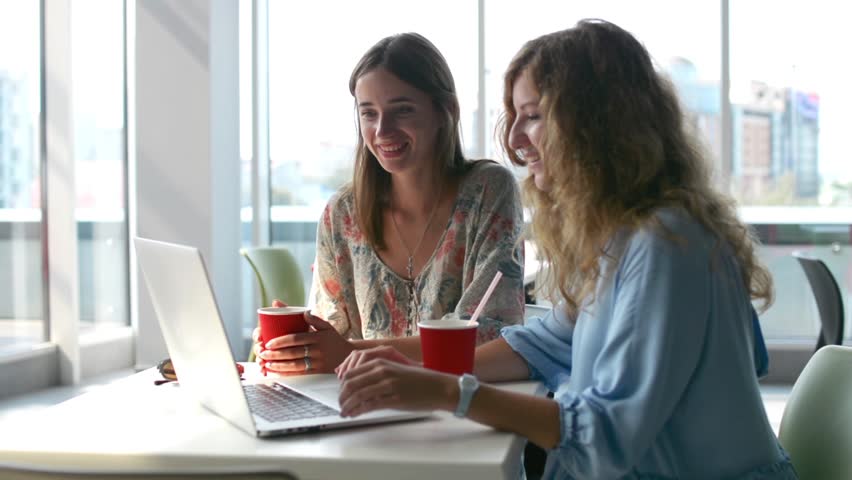 Girls Using laptop computer in coffee shop | Shutterstock HD Video #31368424