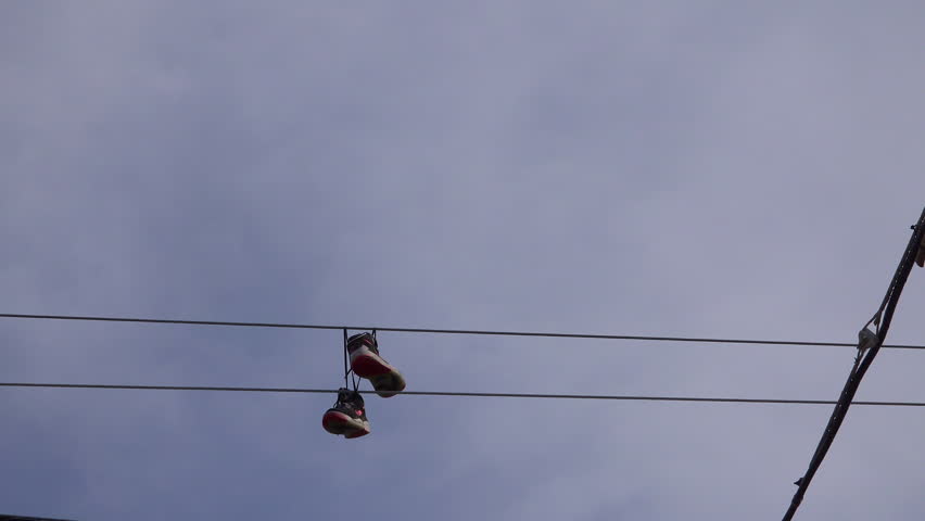 tennis shoes on power lines