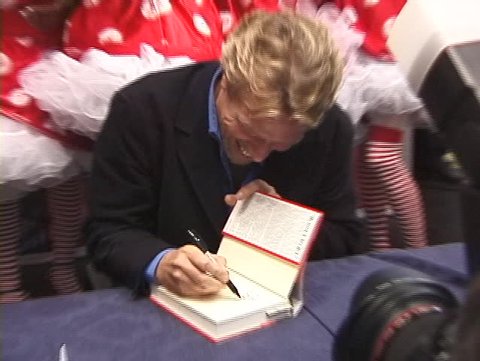NEW YORK, USA – CIRCA 1998: Billionaire Richard Branson presents and signs the first edition of his autobiography  book 'How I Lost My Virginity', New York, USA circa 1998

